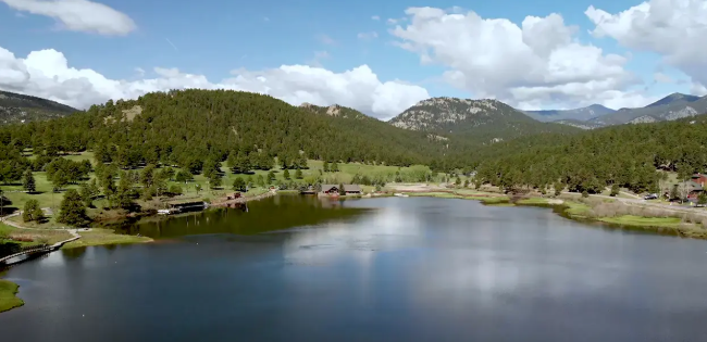 image of evergreen lake, colorado with surrounding mountains